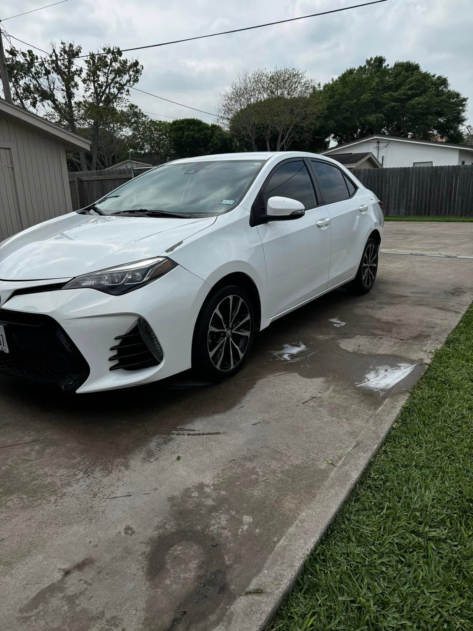 White Toyota Corolla SE, glass and trim cleaned edge to edge